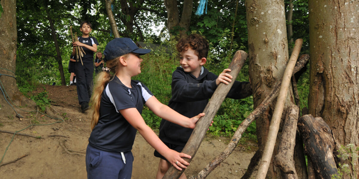 outdoor learning in forest school at manor way primary academy